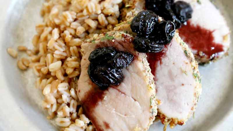 Almond crusted pork loin with red wine raisins